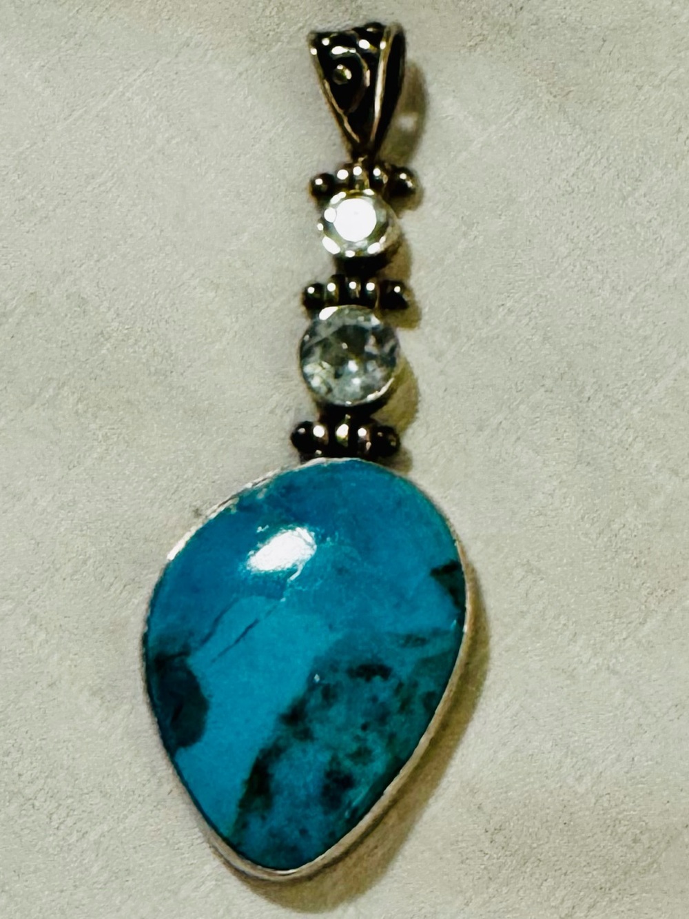 HandmadeSterling Silver Turquoise Teardrop Pendant with Light Blue Stone Accents